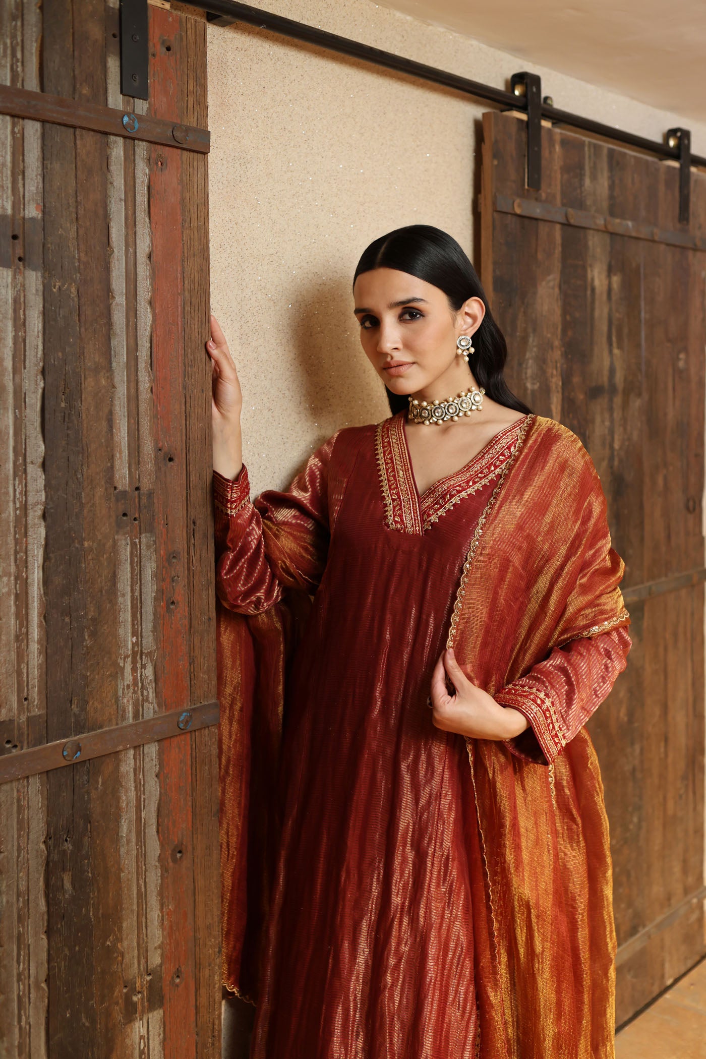 MAROON HAND-EMBROIDERED PURE SILK WITH METALLIC STRIPES KURTA PAIRED WITH PURE SILK TISSUE SHARARA & DUPATTA SET