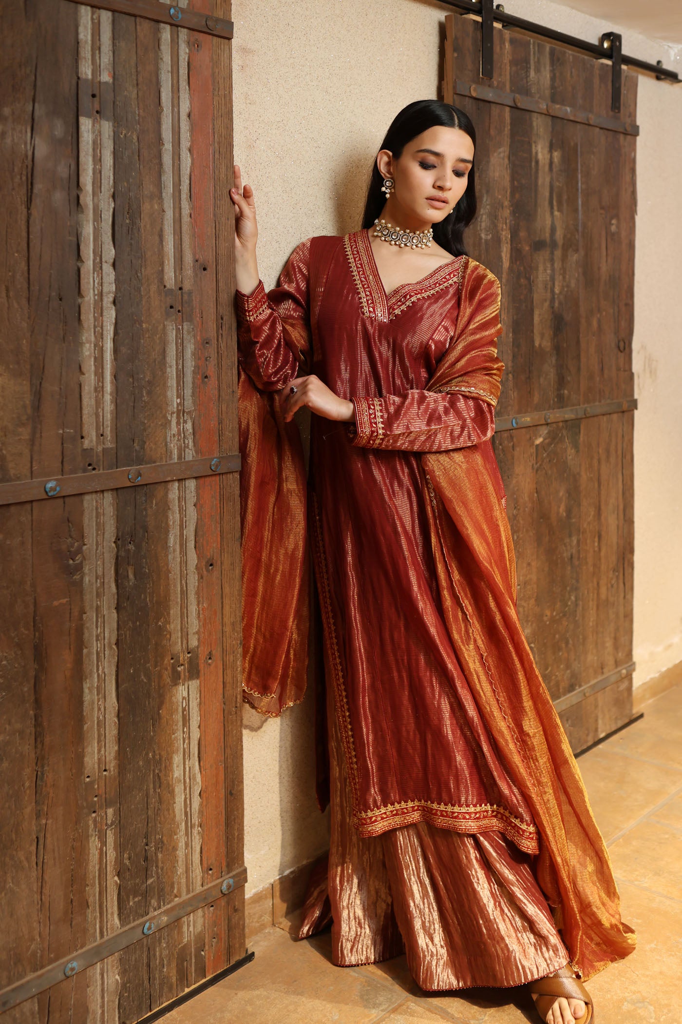 MAROON HAND-EMBROIDERED PURE SILK WITH METALLIC STRIPES KURTA PAIRED WITH PURE SILK TISSUE SHARARA & DUPATTA SET